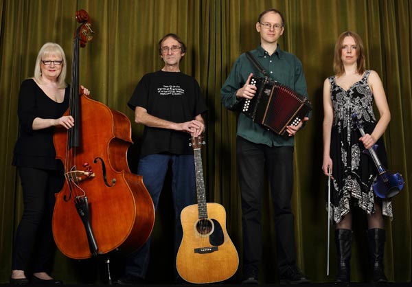 Vertical Expression standing in a row holding their instruments